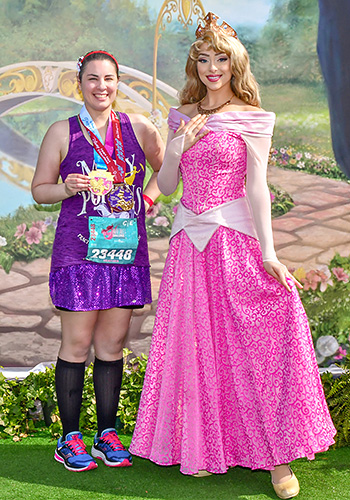 Meeting Aurora at Disney World with rundisney princess half marathon medal